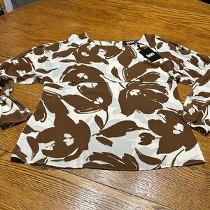 DKNY cold shoulder style blouse. New w/tags. Cream and brown floral. Size Small.